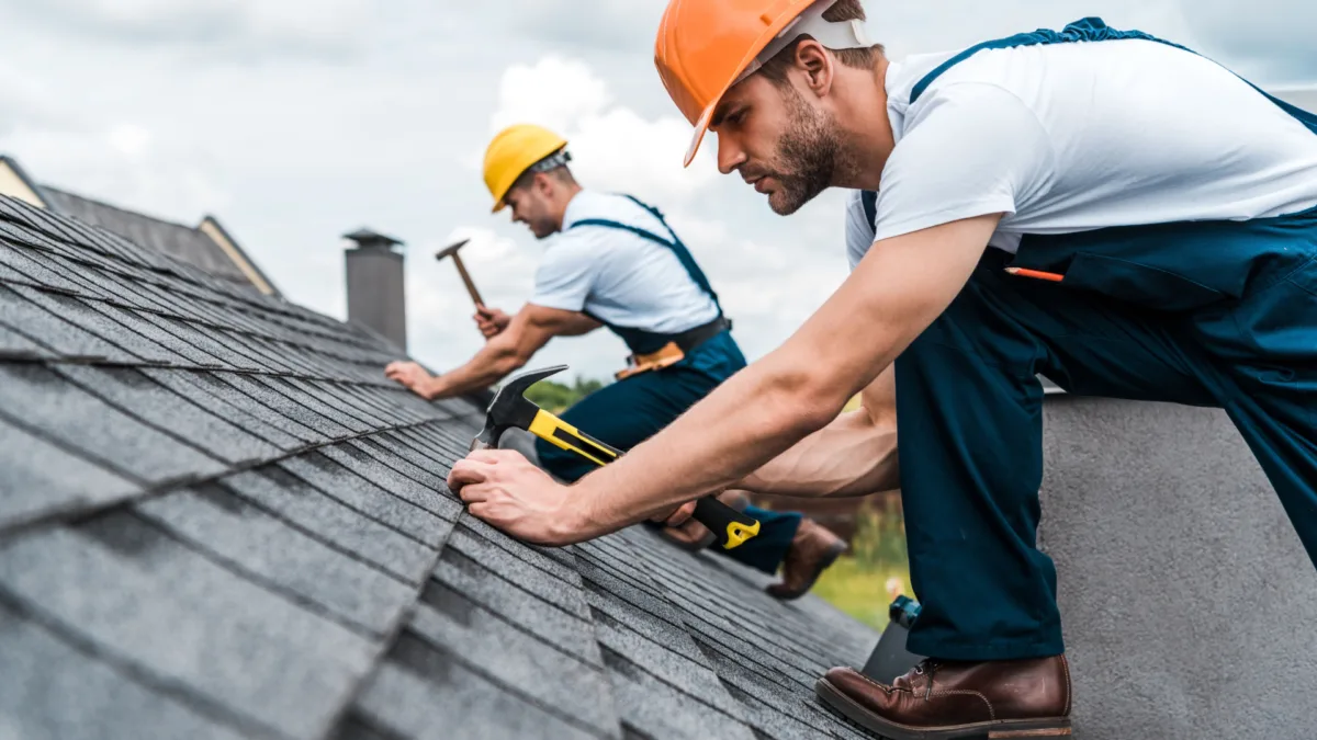Professional roofing crew installing a new roof on a Pensacola home